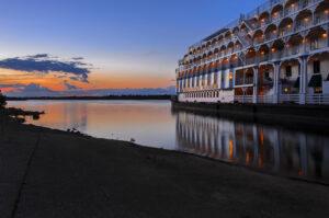 Photo of sunset on the Ohio River with the reflection of the American Queen Riverboat, Paducah Kentucky by Phyllis Russell Photography